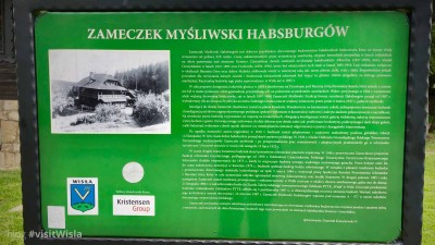 Tablica opisująca dzieje obecnej siedziby PTTK Wisła.